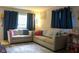 Comfortable living room with modern couches, neutral decor, and ample natural light at 219 N 9Th Ave, Beech Grove, IN 46107