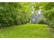The backyard has a well kept lawn at 2359 N Gale St, Indianapolis, IN 46218