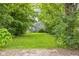 The backyard has a well kept lawn at 2359 N Gale St, Indianapolis, IN 46218