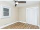 Well-lit bedroom with new ceiling fan and wood-look floors at 2359 N Gale St, Indianapolis, IN 46218