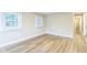 Bright bedroom featuring wood-look floors and generous natural light at 2359 N Gale St, Indianapolis, IN 46218