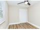 Cozy bedroom featuring wood-look floors and a bright window at 2359 N Gale St, Indianapolis, IN 46218