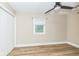 Neutral bedroom with wood-look floors and closet at 2359 N Gale St, Indianapolis, IN 46218