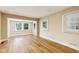 Bright open-concept living room with vinyl flooring and windows offering plentiful natural light at 2359 N Gale St, Indianapolis, IN 46218