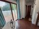 Bright bathroom with deck access, tile flooring, and clawfoot tub at 251 North St, Danville, IN 46122