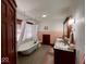 Bright bathroom featuring a classic clawfoot tub, natural light, decorative vanity, and vintage-inspired fixtures at 251 North St, Danville, IN 46122