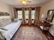 Inviting bedroom featuring a daybed, neutral decor, and natural light from the windows at 251 North St, Danville, IN 46122
