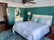Stylish bedroom with accent wall, modern ceiling fan, and well-lit space at 251 North St, Danville, IN 46122