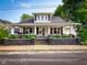 Classic home featuring a covered porch with charming details and well-maintained landscaping at 251 North St, Danville, IN 46122