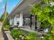 Inviting front porch with rocking chairs, lush landscaping, and a cozy atmosphere at 251 North St, Danville, IN 46122
