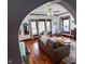 Open living room features hardwood floors, a ceiling fan, and an archway leading to another room at 251 North St, Danville, IN 46122