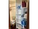 Linen closet with wooden shelves and towels and other supplies for bedroom and bathroom at 251 North St, Danville, IN 46122