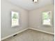 Bedroom with two windows offering ample natural light at 2801 E Southport Rd, Indianapolis, IN 46227