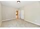Bright bedroom features plush carpet, neutral walls, and closet with sliding doors at 2801 E Southport Rd, Indianapolis, IN 46227