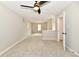 Large bedroom featuring neutral paint and carpet, and leads to other rooms at 2801 E Southport Rd, Indianapolis, IN 46227
