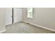 Clean bedroom with soft carpet, fresh paint, and a closet with sliding doors at 2801 E Southport Rd, Indianapolis, IN 46227