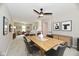 This dining room features a modern table with black chairs, stylish decor, and a ceiling fan for added comfort at 2801 E Southport Rd, Indianapolis, IN 46227