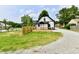 Charming home with a freshly built deck and gravel driveway offering outdoor living and parking space at 2801 E Southport Rd, Indianapolis, IN 46227