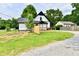 Charming home with a newly constructed deck providing outdoor space and a gravel driveway for parking at 2801 E Southport Rd, Indianapolis, IN 46227