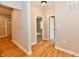 Hallway with luxury vinyl flooring leading to bedrooms and living areas at 2801 E Southport Rd, Indianapolis, IN 46227