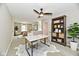 Bright office space features a modern white and gold desk, shelving, neutral colors, and natural light at 2801 E Southport Rd, Indianapolis, IN 46227