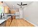 Well lit eat-in kitchen with stainless appliances, natural wood cabinets and updated fixtures at 2801 E Southport Rd, Indianapolis, IN 46227