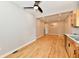 Open concept living area showcasing hardwood floors, neutral paint and modern lighting at 2801 E Southport Rd, Indianapolis, IN 46227