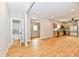 Newly renovated living room and kitchen with hardwood floors throughout at 2801 E Southport Rd, Indianapolis, IN 46227
