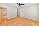 Bright living room features hardwood floors, neutral walls, and a modern ceiling fan at 2801 E Southport Rd, Indianapolis, IN 46227