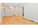 Bright living area with luxury vinyl flooring, neutral paint and updated lighting at 2801 E Southport Rd, Indianapolis, IN 46227