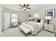 This neutral bedroom features natural light, a large bed with stylish accents, and a relaxed, cozy ambiance at 2801 E Southport Rd, Indianapolis, IN 46227