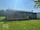 View of home's back wooden deck and grassy backyard, with privacy fence at 2930 N Rural St, Indianapolis, IN 46218