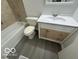 Bathroom featuring a vanity with storage, toilet, and bathtub at 2930 N Rural St, Indianapolis, IN 46218