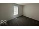 Comfortable bedroom with cozy carpeting and large window, perfect for relaxation at 2930 N Rural St, Indianapolis, IN 46218