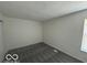 Simple bedroom with neutral walls, a carpeted floor, and a window at 2930 N Rural St, Indianapolis, IN 46218
