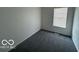 Serene bedroom showcasing plush carpeting, a large window, and a tranquil atmosphere at 2930 N Rural St, Indianapolis, IN 46218