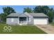 Charming single-story home with a gray exterior, attached garage, and well-maintained front lawn at 2930 N Rural St, Indianapolis, IN 46218