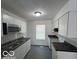Modern kitchen with stainless steel appliances, granite countertops, and ample cabinet space at 2930 N Rural St, Indianapolis, IN 46218
