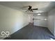 Bright, open living space with sleek flooring and a modern ceiling fan; seamlessly connects to kitchen at 2930 N Rural St, Indianapolis, IN 46218