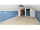 Cozy attic space with blue walls, carpeted floors, and built-in storage at 313 N 16Th Ave, Beech Grove, IN 46107