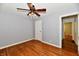 Bedroom with hardwood floors, light gray walls, ceiling fan, and a closet at 313 N 16Th Ave, Beech Grove, IN 46107