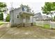 Rear view featuring the side of the house, fenced in yard, and a driveway at 313 N 16Th Ave, Beech Grove, IN 46107
