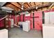 Laundry room with red brick walls and painted ceiling with a washing machine and dryer at 313 N 16Th Ave, Beech Grove, IN 46107