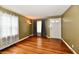 Inviting living room with hardwood floors, large windows, and neutral wall color at 313 N 16Th Ave, Beech Grove, IN 46107