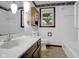 Bright bathroom with white walls, sink, and wooden cabinets at 3235 Flintwood Dr, Columbus, IN 47203