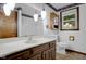 Classic bathroom with bright vanity, sink, and hanging crystal lights at 3235 Flintwood Dr, Columbus, IN 47203