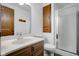 A bathroom featuring a vanity with sink, toilet, and a glass-enclosed shower at 3235 Flintwood Dr, Columbus, IN 47203