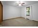 Cozy bedroom with bright window, ceiling fan, and carpet at 3235 Flintwood Dr, Columbus, IN 47203