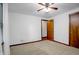 Bedroom featuring a ceiling fan, natural light, and wooden closet at 3235 Flintwood Dr, Columbus, IN 47203