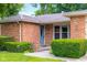 Close-up view of the home's entrance, showcasing a stylish front door and manicured landscaping at 3235 Flintwood Dr, Columbus, IN 47203
